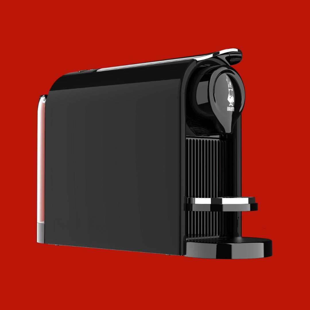Black coffee machine on a red background