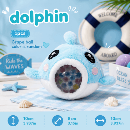 Plush toy dolphin with colorful beads inside, on a blue background with nautical elements.