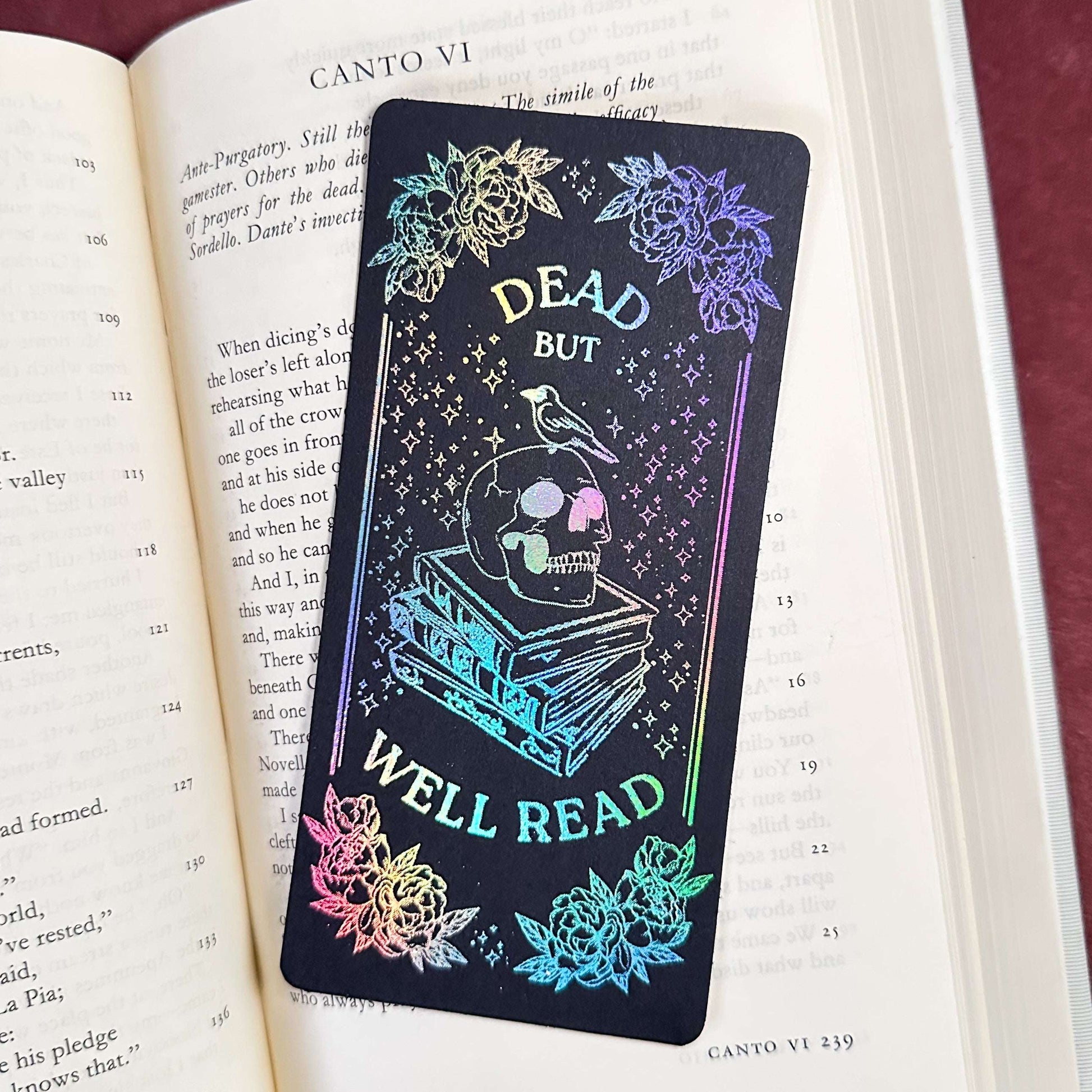 Holographic bookmark with skull design on an open book
