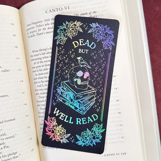Holographic bookmark with skull design on an open book