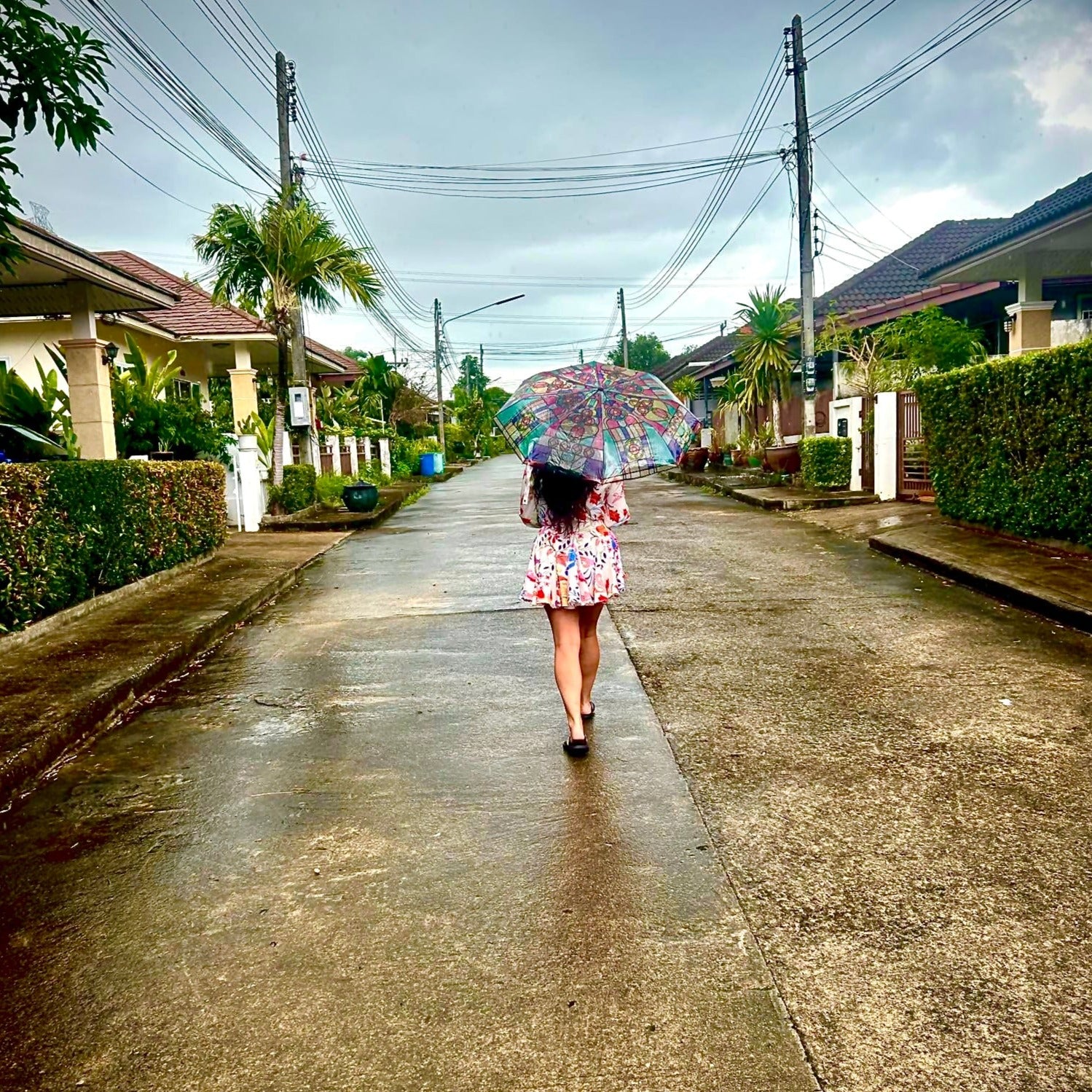 girl walking with umbrella