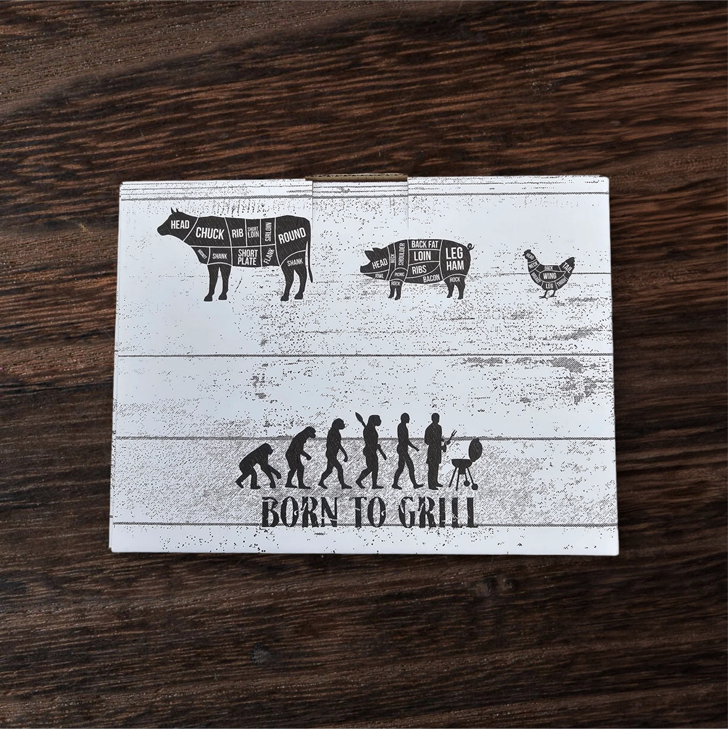 Wooden cutting board with grill diagram and 'Born to Grill' text on a wooden surface