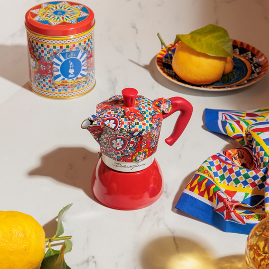 Colorful teapot and tea accessories on a marble surface