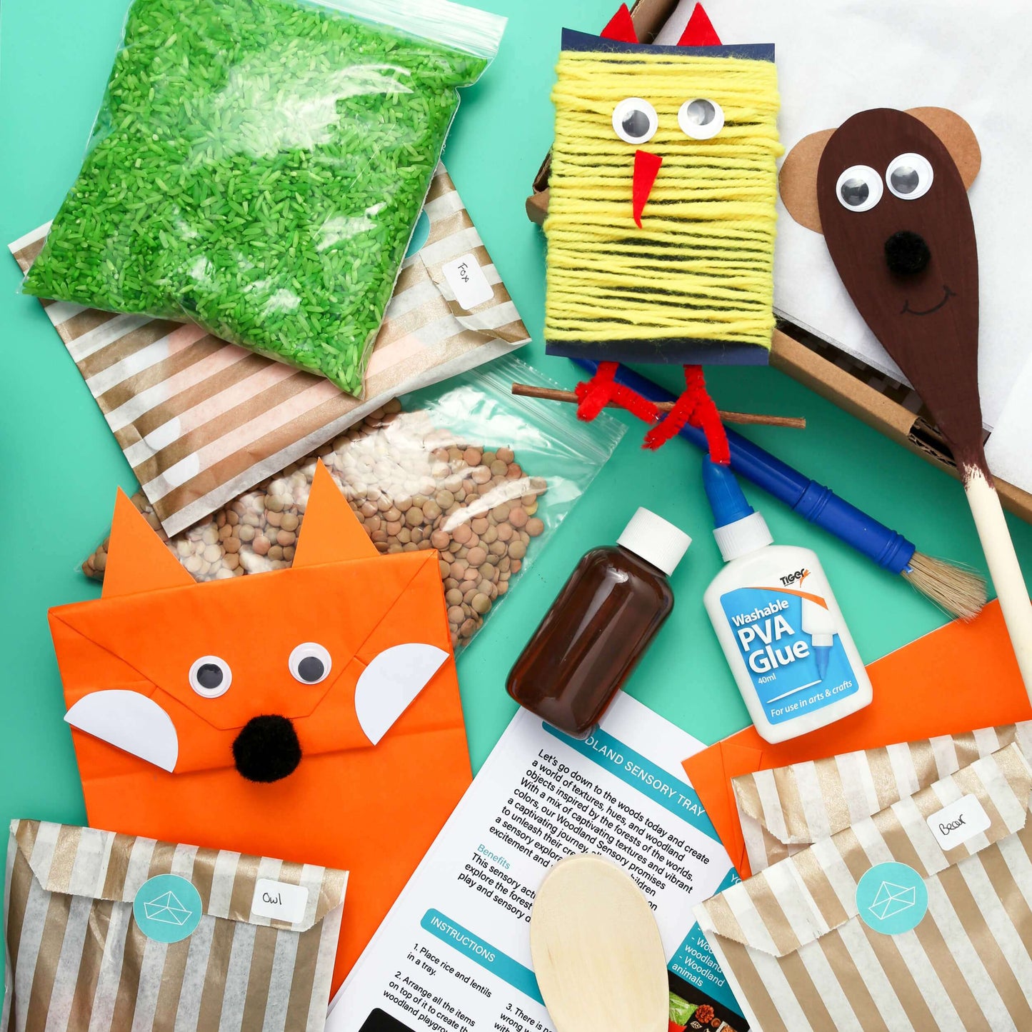 Assorted craft materials and finished craft items on a green background