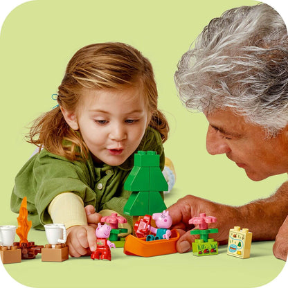 Child and elderly person playing with colorful building blocks on a green background
