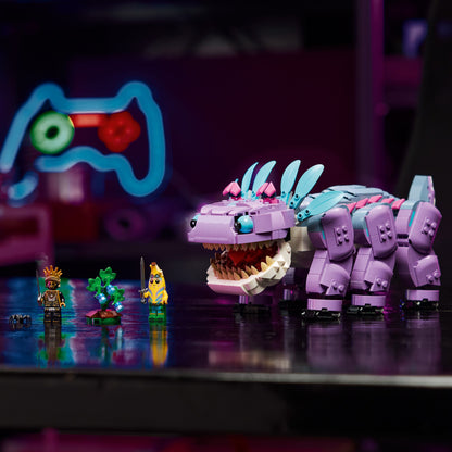 Toy figure of a purple creature with a large mouth, surrounded by smaller figures on a reflective surface.