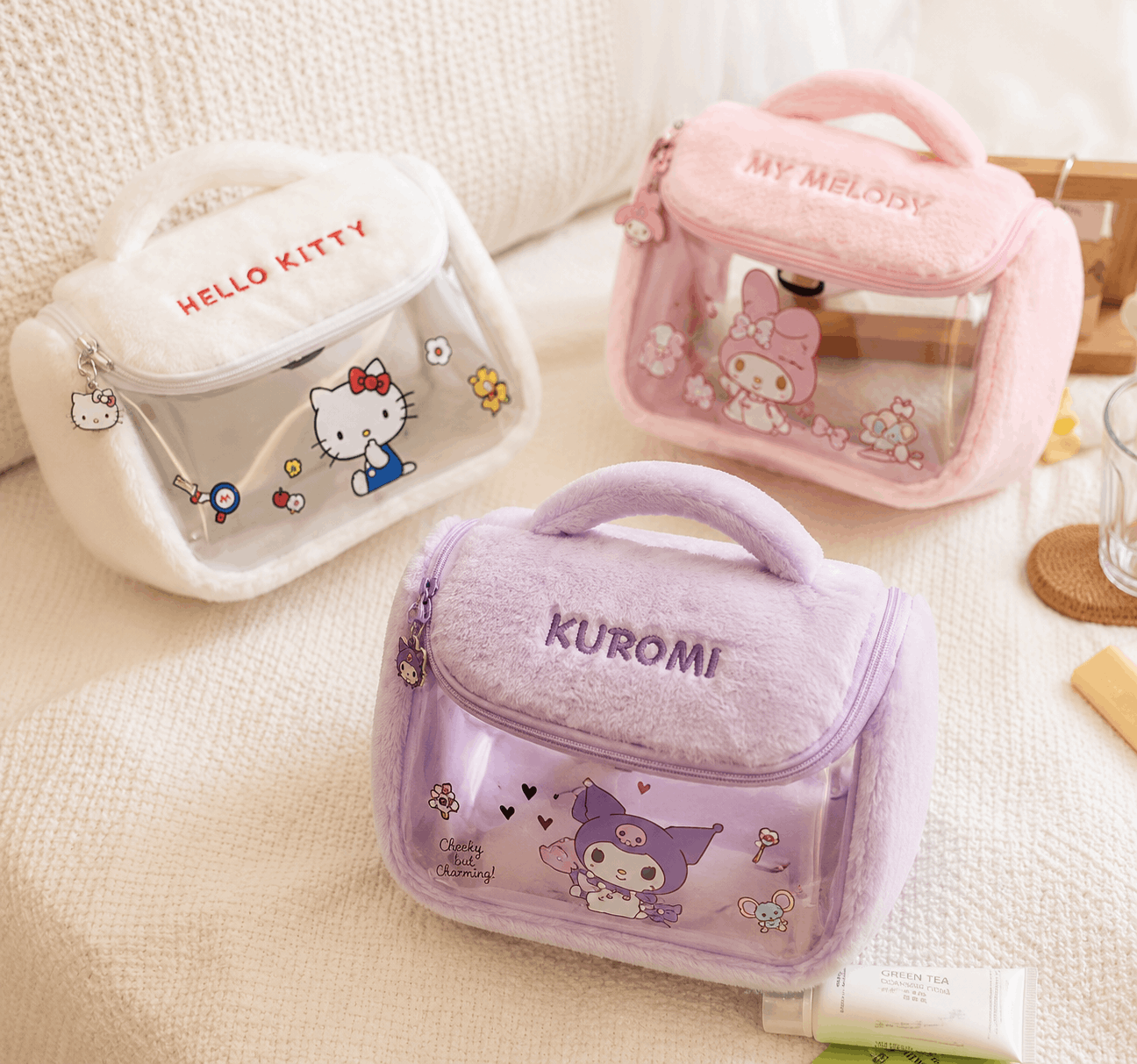 Three small bags with character designs on a light background