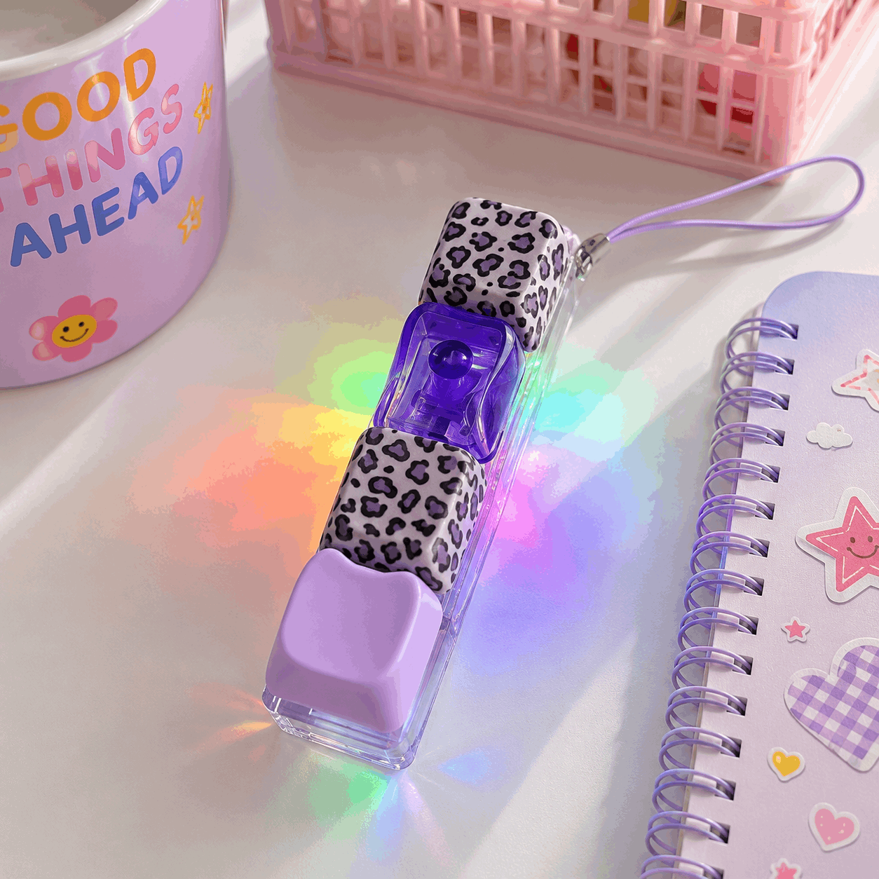 LED light-up pen with leopard print case on a white surface with colorful lighting effects.