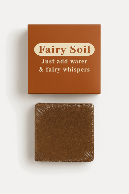 Box of 'Fairy Soil' with a bar of brown soap on a white background