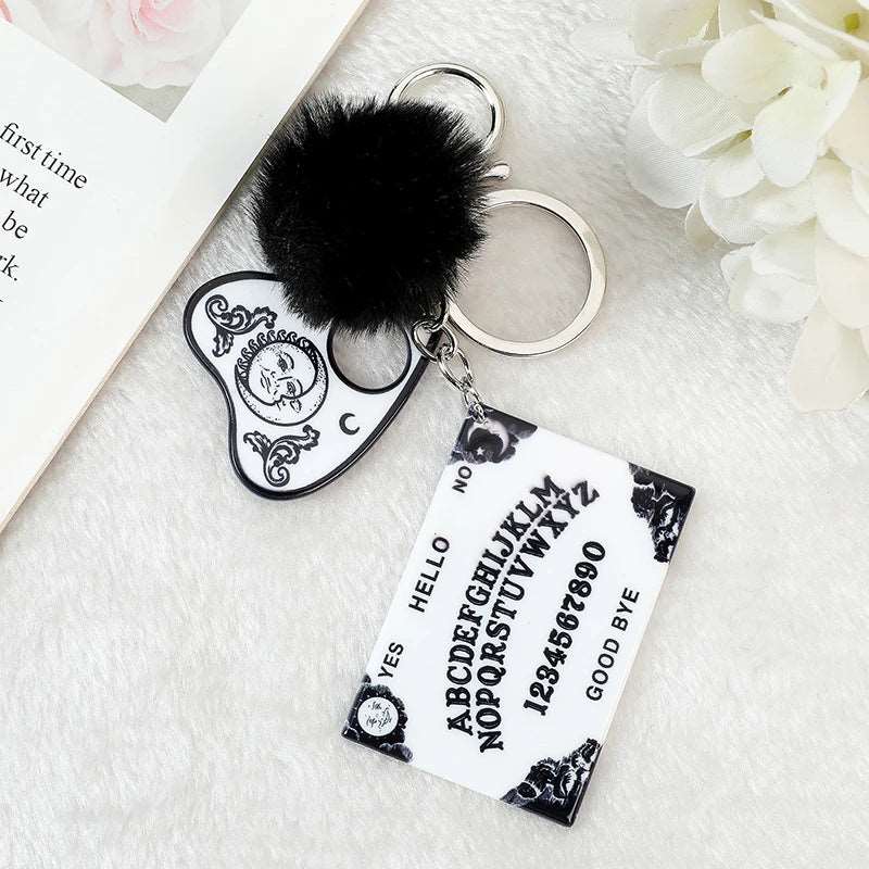 white Halloween Ouija Board Keychain with pom and planchette