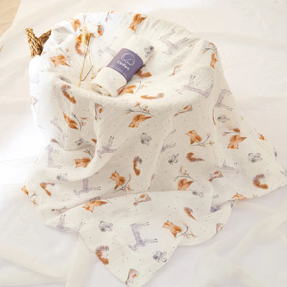 Floral-patterned fabric with a roll of tape on a light background