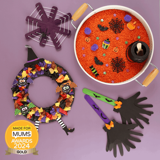 Halloween-themed items including a wreath, sand tray, and decorations on a purple background with 'Made for Mums Awards 2024 Gold' badge.