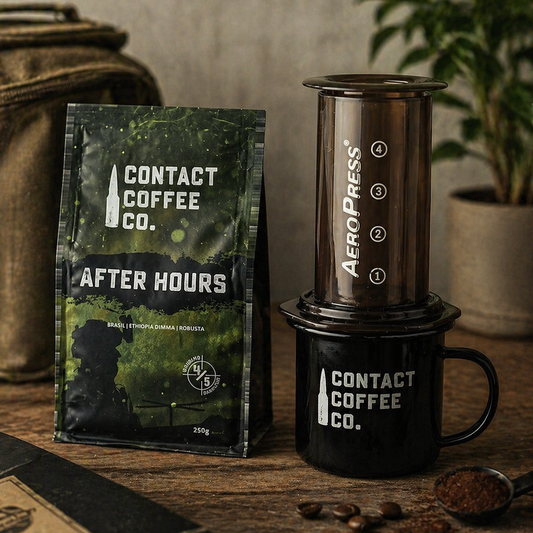 Contact Coffee Co. After Hours coffee package and Aeropress coffee maker on a wooden surface.