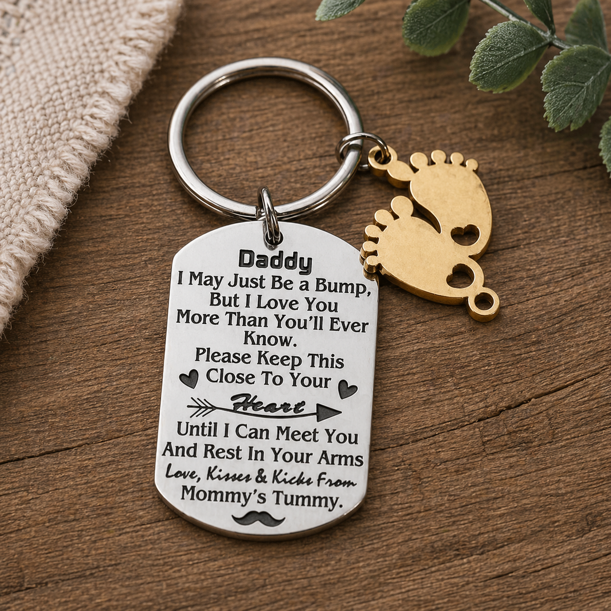 Keychain with engraved message on a wooden surface