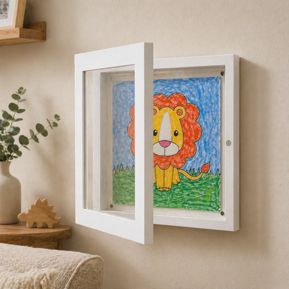 Children's drawing of a lion in a white frame on a beige wall.