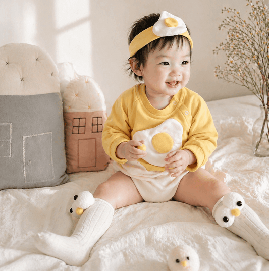 Baby in a fried egg romper 