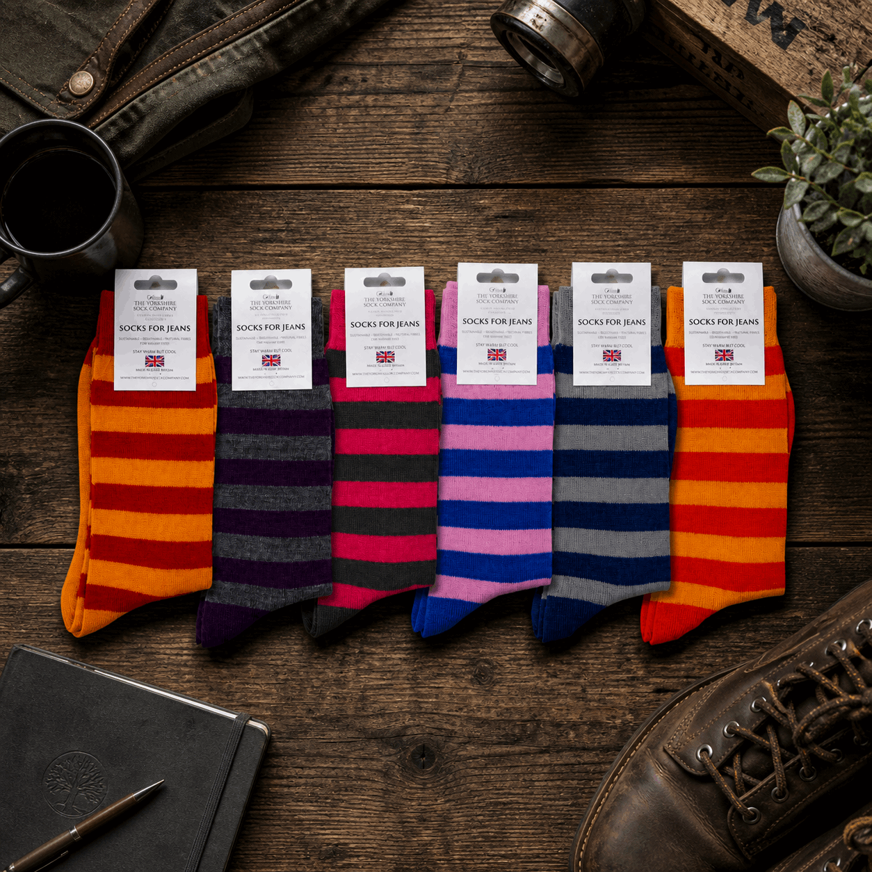 Colourful striped socks on a wooden background 