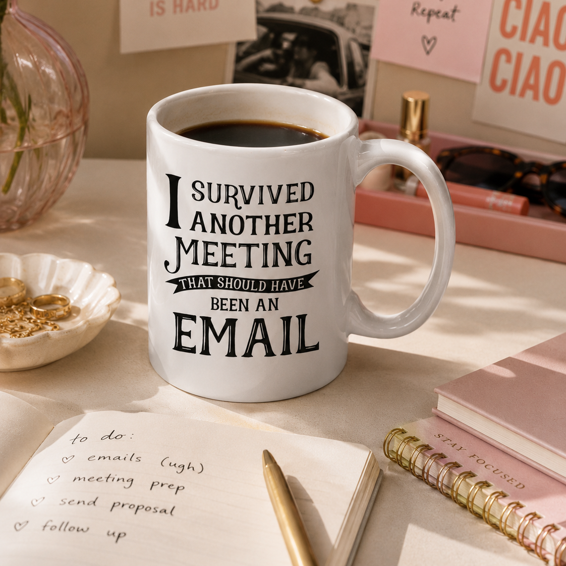 White mug with humorous text on a desk with coffee and stationery items
