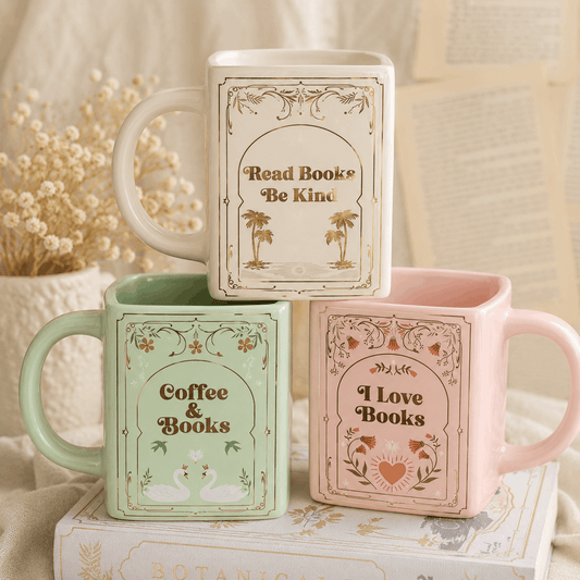 Three mugs with book-themed designs on a soft background