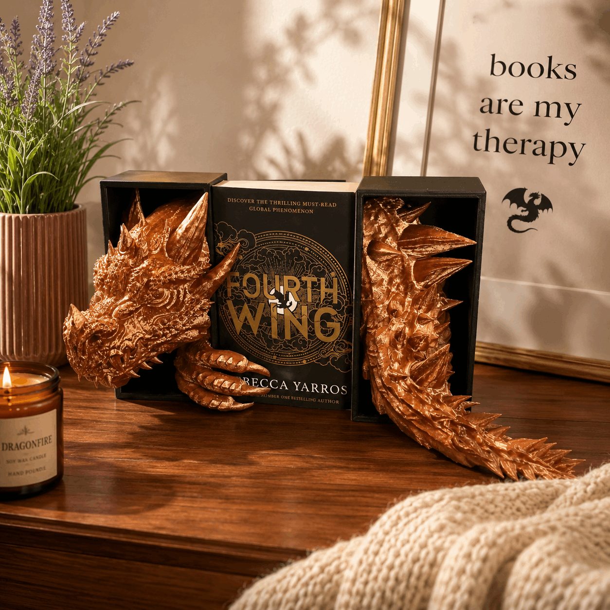Book with dragon design on cover, surrounded by decorative elements on a wooden surface.
