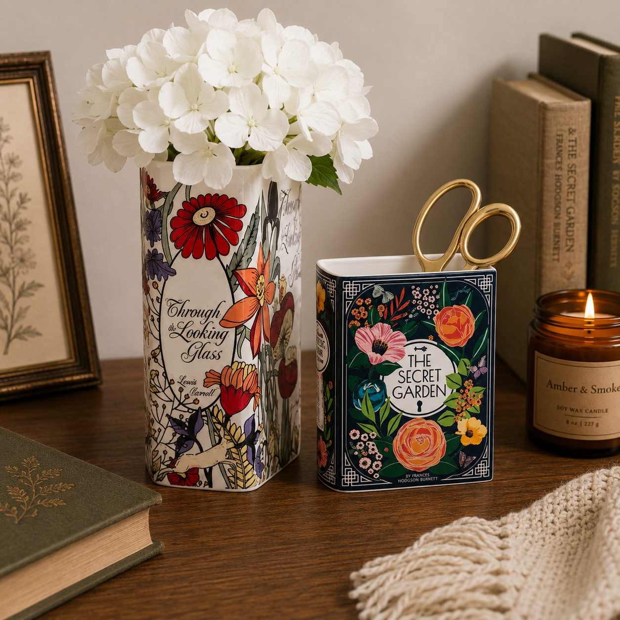 Decorative items including a vase with flowers, a box with 'The Secret Garden' design, and a candle on a wooden surface.
