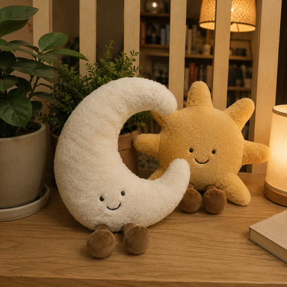 Plush moon and star toys on a wooden surface with a warm, indoor setting.