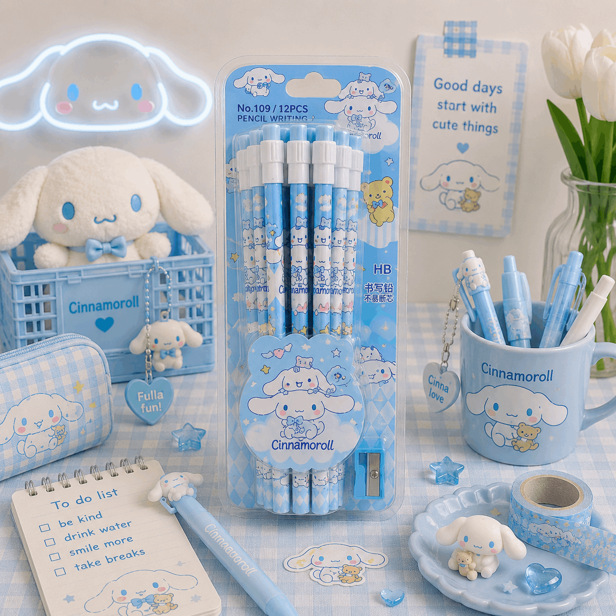 Cinnamoroll-themed stationery set with pens, notebook, and mug on a light background