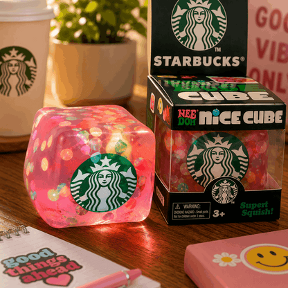 Starbucks-themed cube toy with packaging on a wooden surface