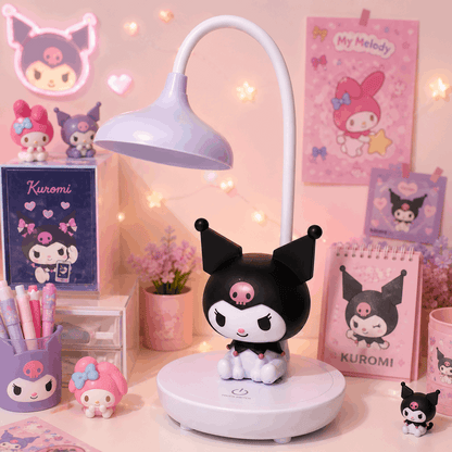 Anime character figurine on a desk with pink-themed decor