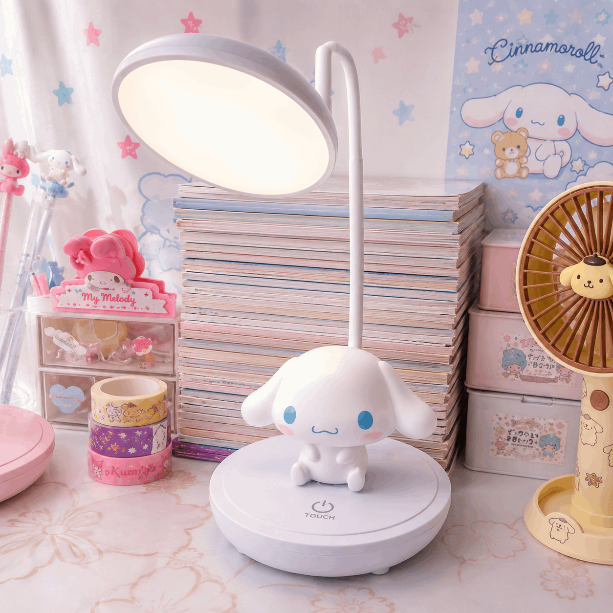 Cute desk lamp with a character design on a desk with stationery items.