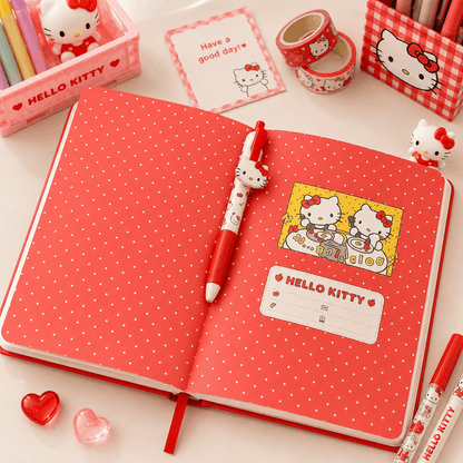 Hello Kitty-themed notebook with pen and stationery items on a white background