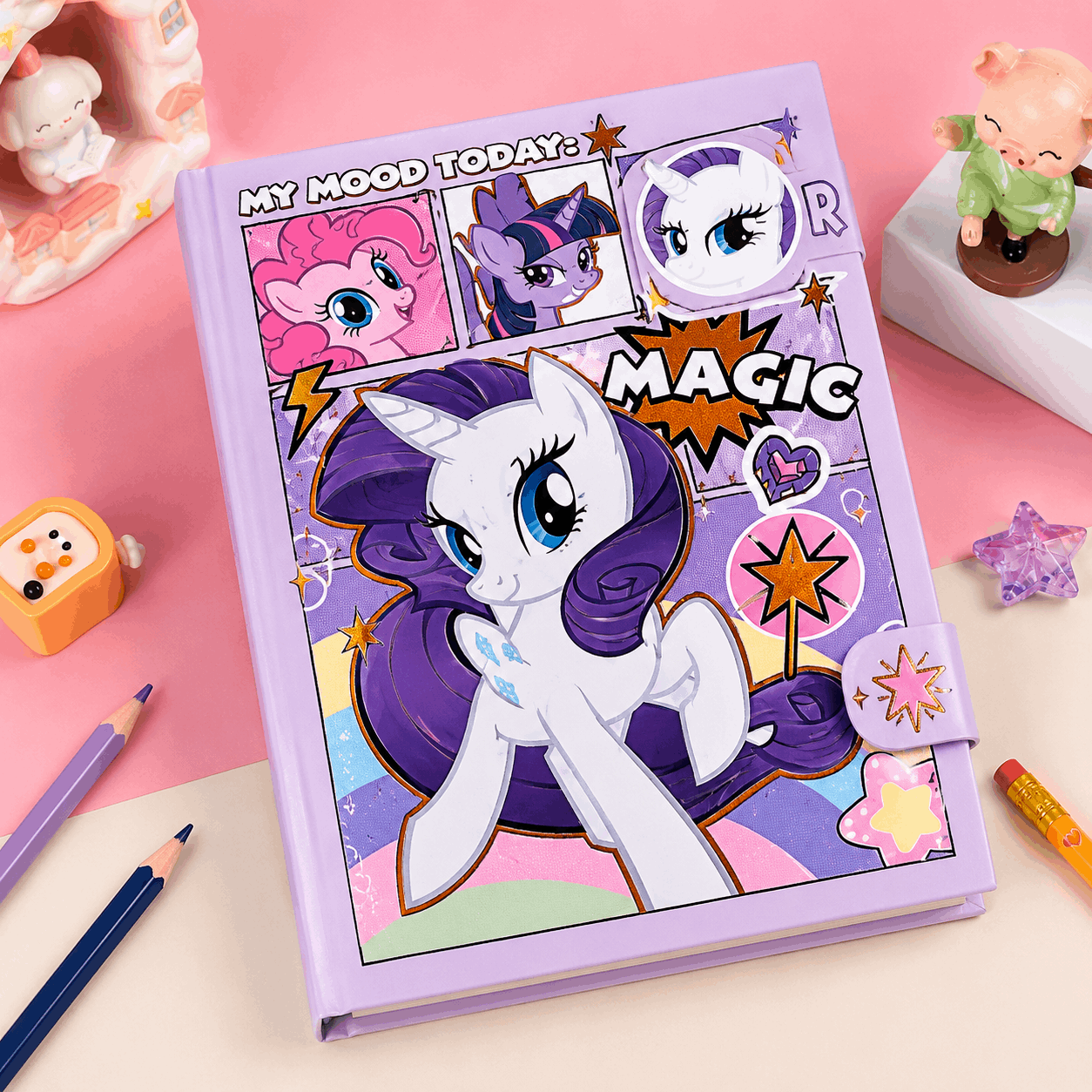 Colorful notebook with cartoon pony design on a pink background