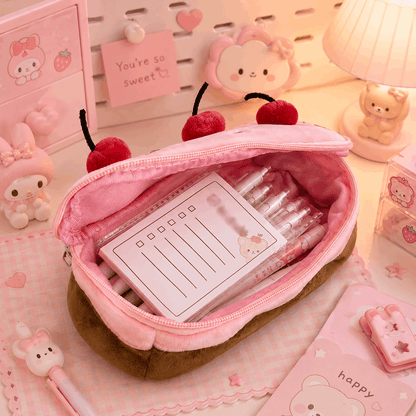Pink stationery set with a heart-shaped pouch on a pink background