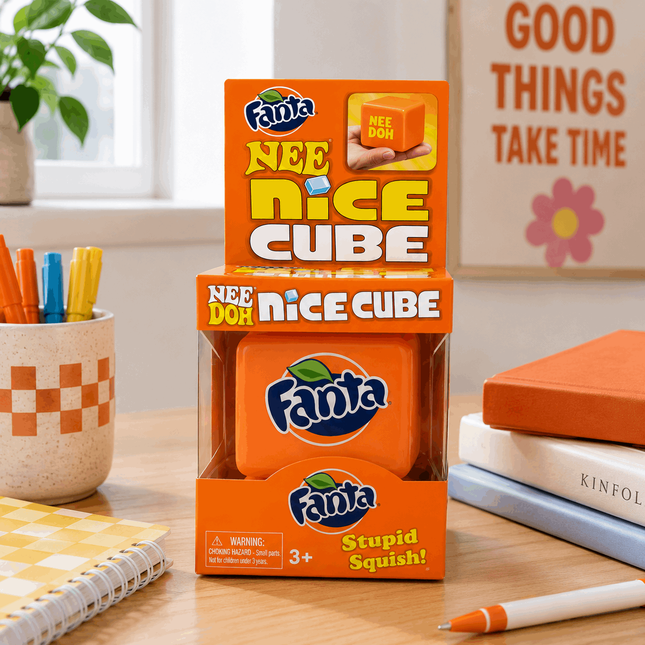 Fanta Nee Nice Cube packaging on a desk with stationery items