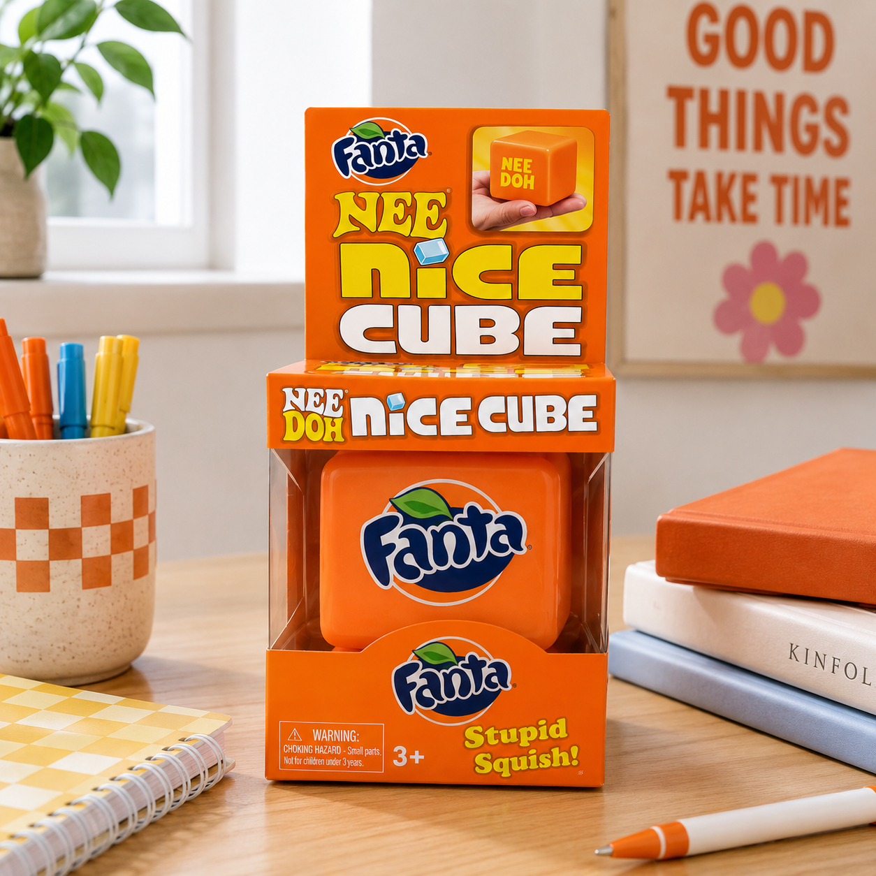 Fanta Nee Nice Cube packaging on a desk with stationery items