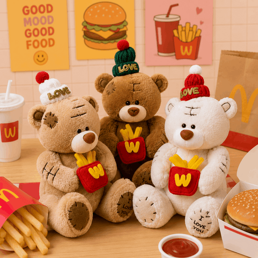 Three teddy bears with McDonald's-themed hats and outfits on a table with fast food items.