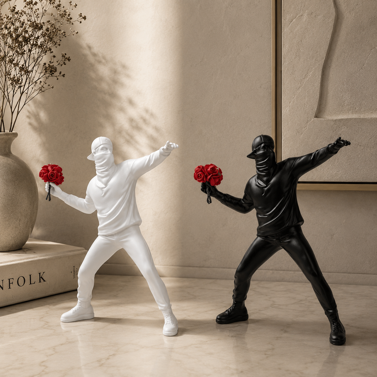 Two ninja figurines, one white and one black, holding red flowers in a decorative setting.