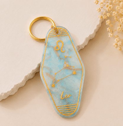 Keychain with 'Leo' and zodiac design on a light background