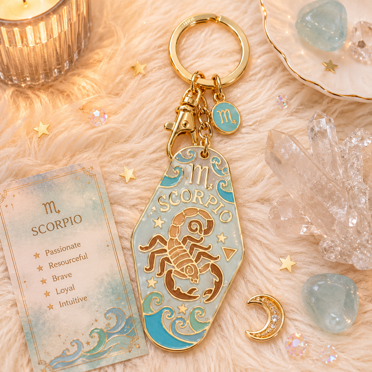 Scorpio zodiac keychain with astrological card on a soft surface with crystals and candles.