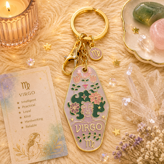 Keychain with Virgo zodiac design on a soft surface with decorative elements.