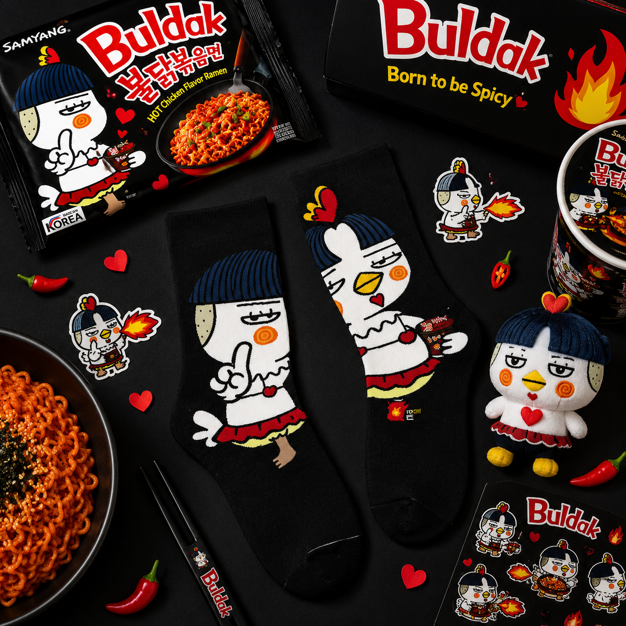 Buldak spicy noodle packaging with cartoon character, socks, and mug on a black background