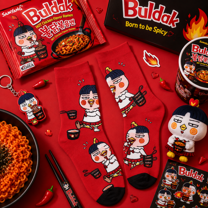 Red-themed Buldak ramen product set with socks, keychain, and plush toy on a red background.