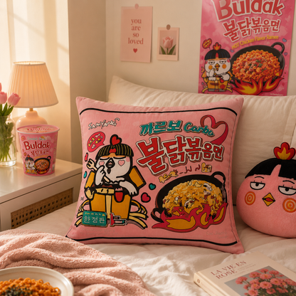 Pink pillow with cartoon character and food graphics on a bed with a 'Buldak' poster in the background.