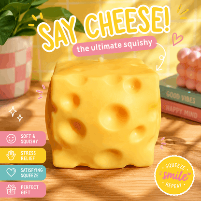Squishy cheese toy with text 'Say Cheese! the ultimate squishy' on a wooden surface.