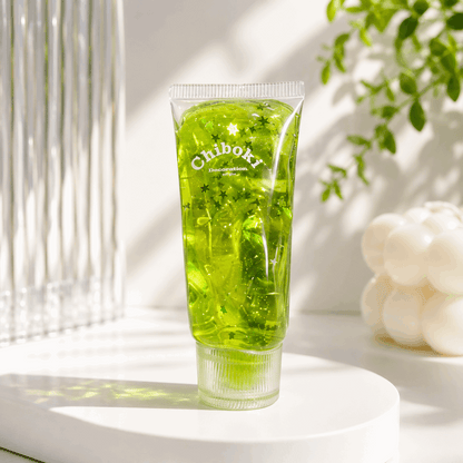 Green gel tube with 'Chiboki' branding on a light surface with a plant in the background