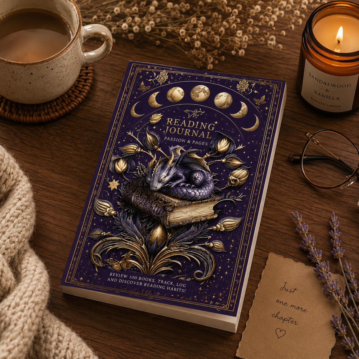 Reading journal with dragon illustration on a wooden table with a cup of coffee and candle.
