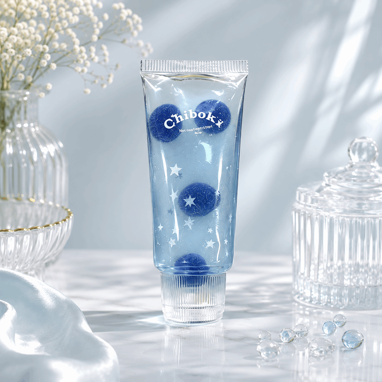 Blue tube with decorative elements on a light background