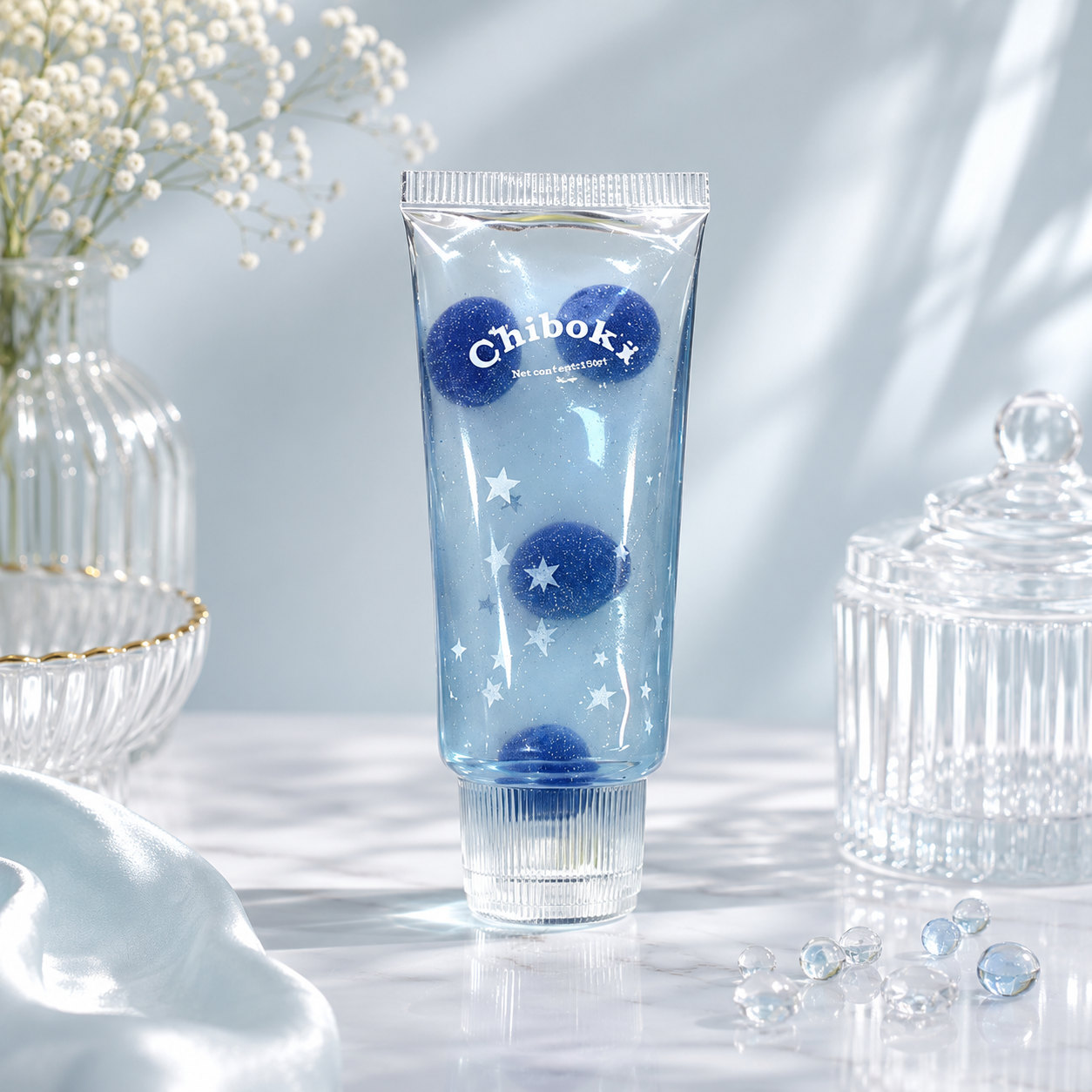 Blue tube with decorative elements on a light background