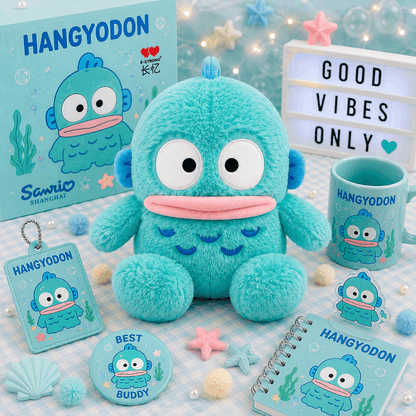 A turquoise cartoon sea monster merchandise set arranged on a pastel blue checkered surface, including a plush toy, box, mug, notebook, card, round sticker, and small accessories. The box and printed items show the brand name Hangyodon and Sanrio Shanghai.