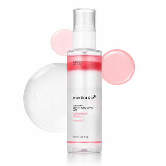 A clear bottle of medicube+ Foin Pink Glycolyone Serum Mist with a white cap, set against a white background with pink circular gel droplets.